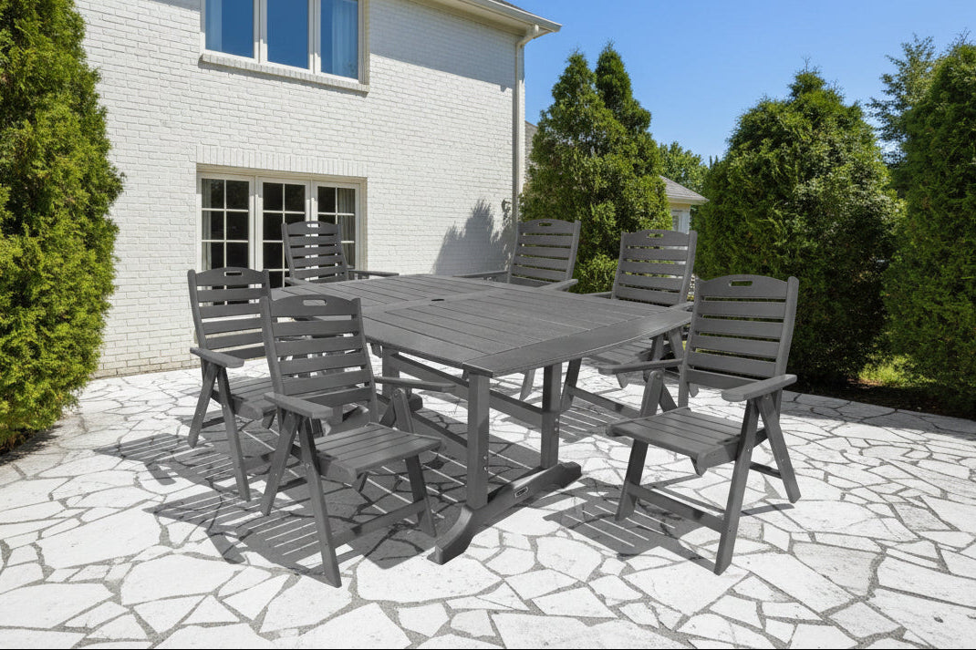 A seven-piece outdoor dining set with a slatted wooden table and six folding chairs in grey color